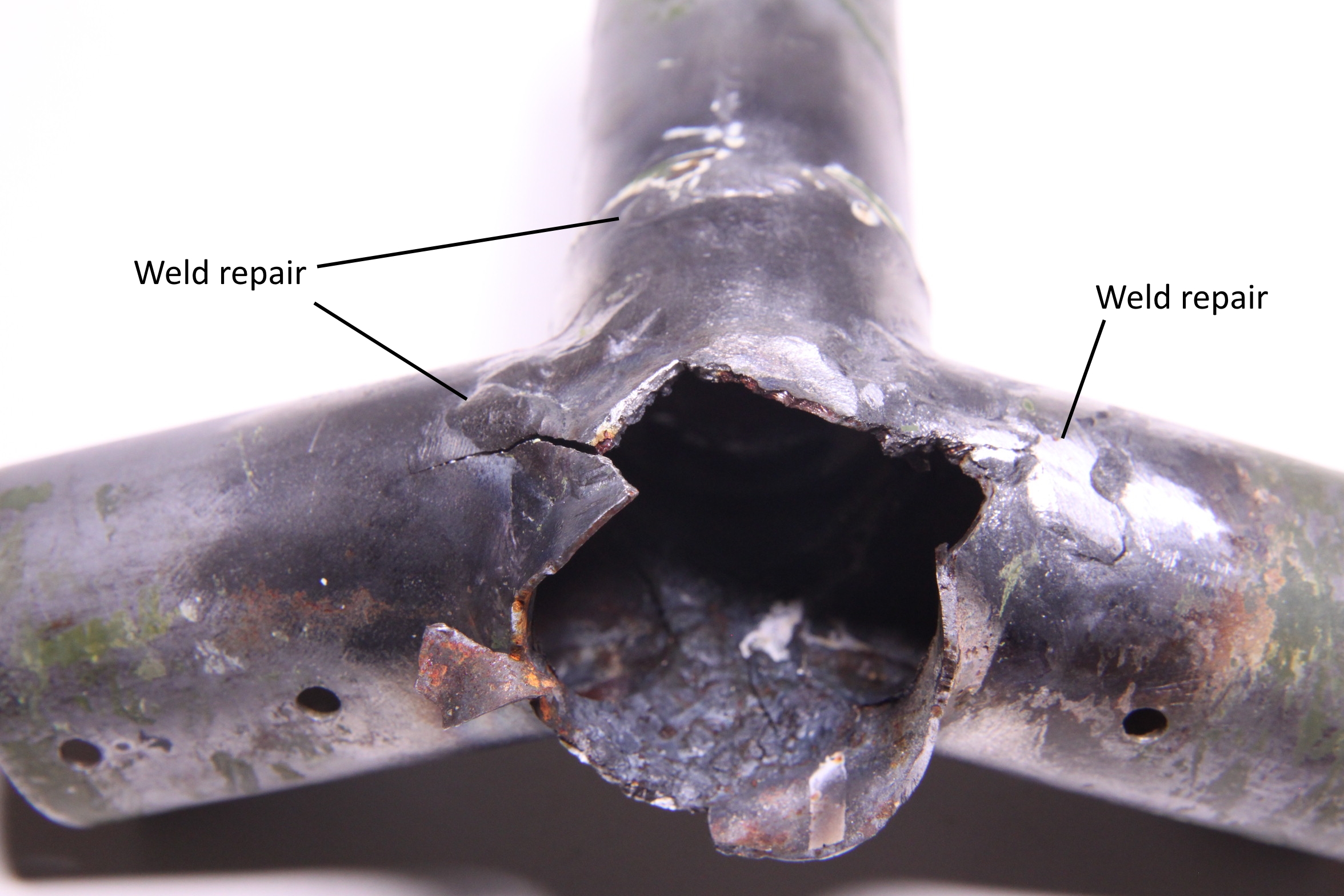 Figure A4: Fracture surface detail of the stabiliser mount (view looking outboard) with locations of previous weld repair identified